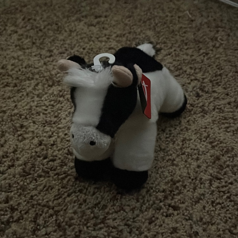 Small fluffy cow stuffed animal. Brand new.